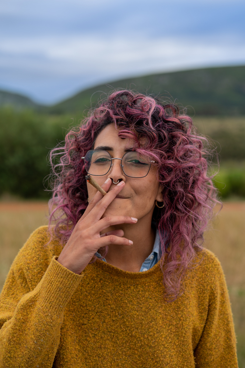 Woman smoking a cannabis joint